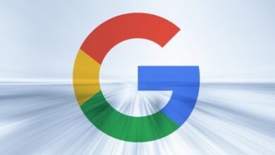 Google logo with red, yellow, green, and blue colors on blurred background.