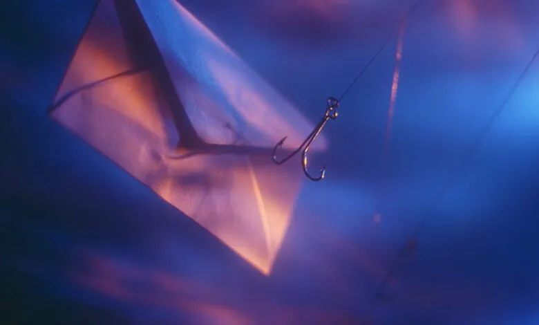 Envelope with fishing hook, representing phishing scams.