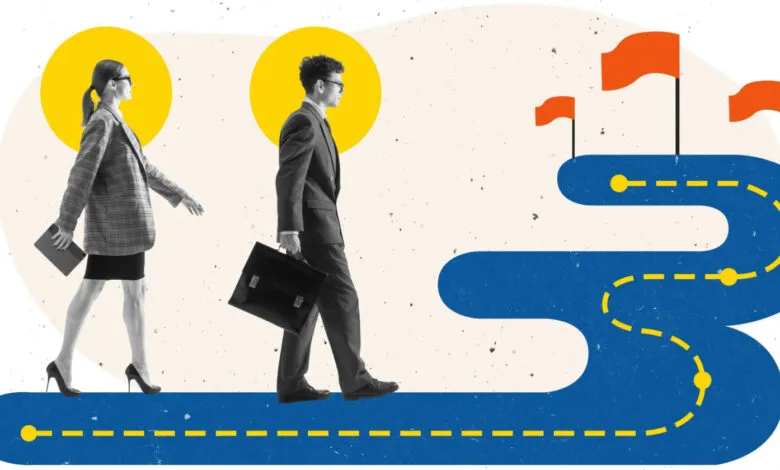 Business professionals walking on a path towards goals represented by flags.