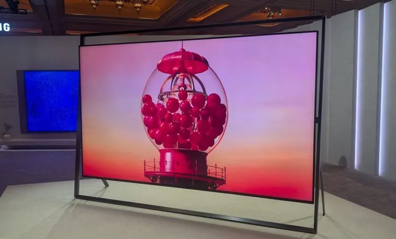 Samsung TV displays a red gumball machine against a sunset background.