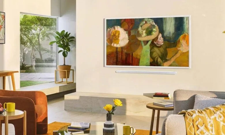 Bright living room featuring Samsung Frame TV displaying artwork above soundbar.