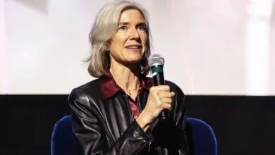 Jennifer Doudna speaks into a microphone at an event.