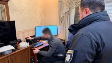 Ukrainian police officer at a computer crime scene.