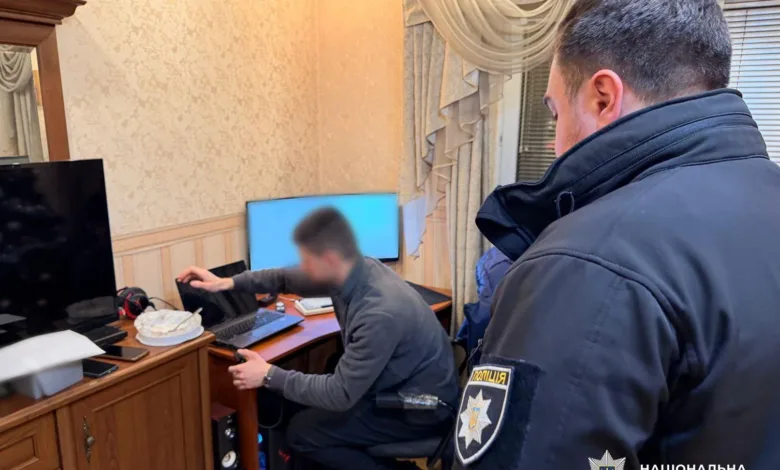 Ukrainian police officer at a computer crime scene.