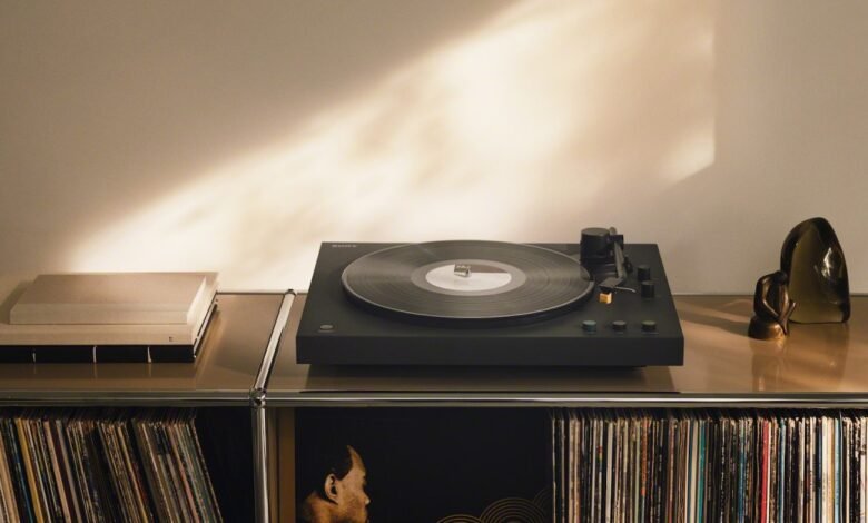 Sony LX5BT turntable on shelf with records and decorative objects.