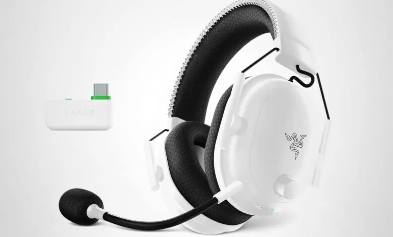 White Razer gaming headset with microphone and wireless USB adapter.
