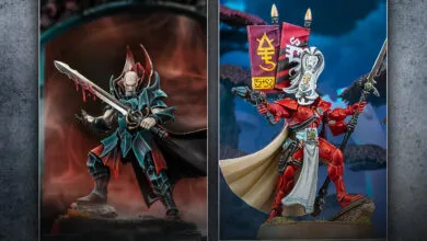 Two Warhammer 40k miniatures: a vampire and a red Eldar figure.