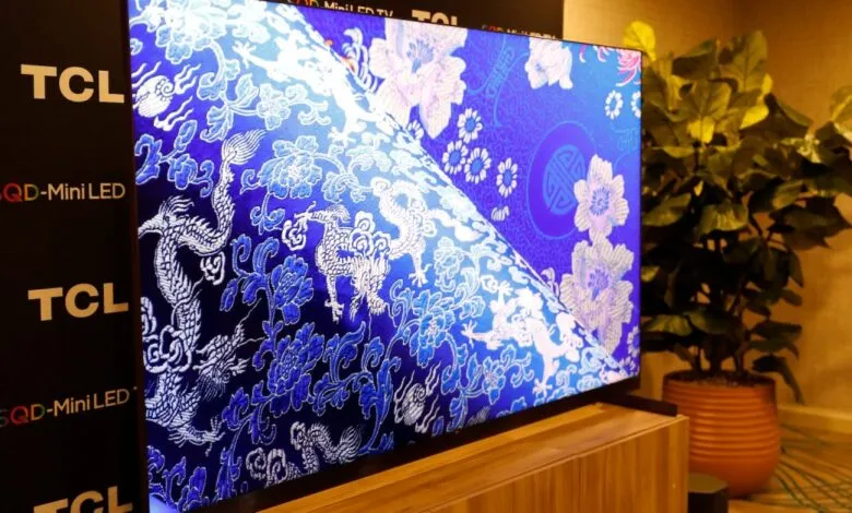 TCL X11L TV displaying intricate blue and white floral pattern.