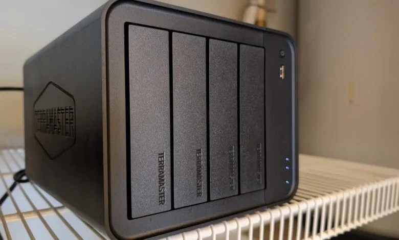 TerraMaster NAS device with four drive bays on a wire shelf.
