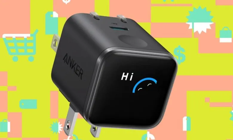 Anker Nano charger with a 'Hi' message on its display.