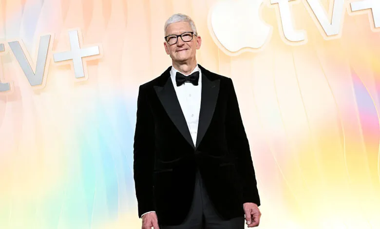 Tim Cook smiles in a tuxedo at Apple TV+'s Emmy party red carpet.