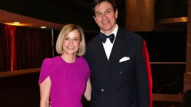 Toto Wolff and Susie Wolff pose together at an event.