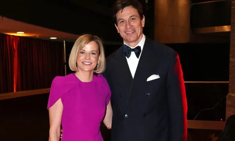 Toto Wolff and Susie Wolff pose together at an event.