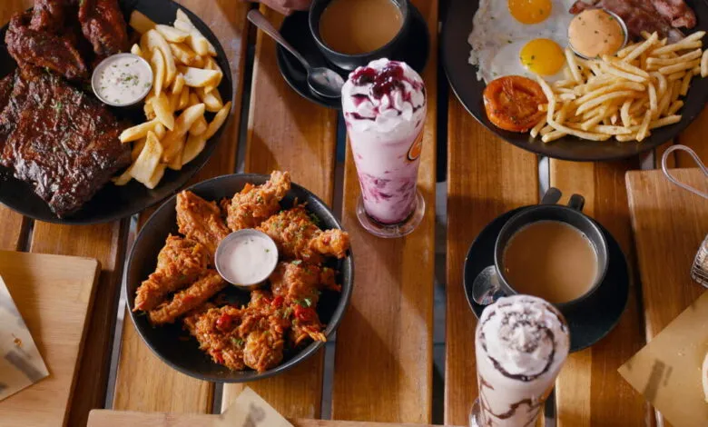 Overhead shot of a table laden with indulgent comfort food.