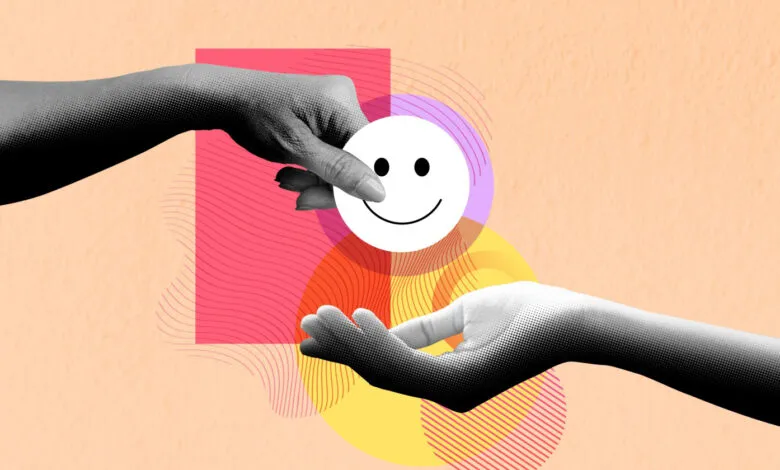 Two hands interact with a smiley face icon against a colorful background.