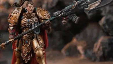 Female Adeptus Custodes model with ornate gold armor and power halberd.
