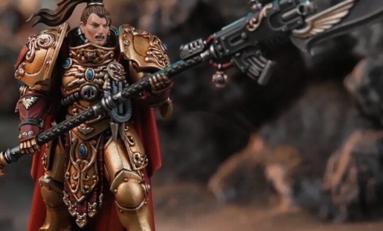 Female Adeptus Custodes model with ornate gold armor and power halberd.