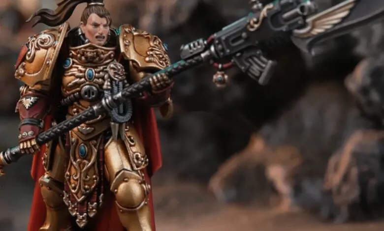 Female Adeptus Custodes model with ornate gold armor and power halberd.