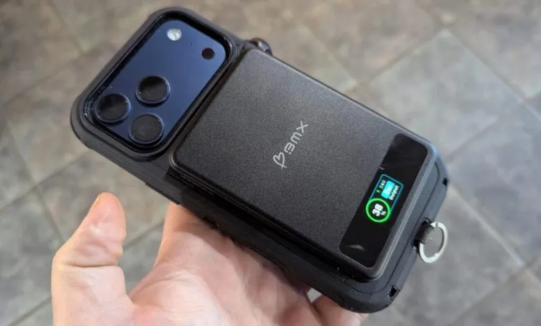 iPhone in black case with attached battery pack showing 39% charge.