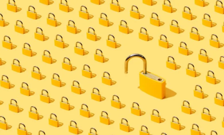 Pattern of yellow padlocks, one open, symbolizing security breach.