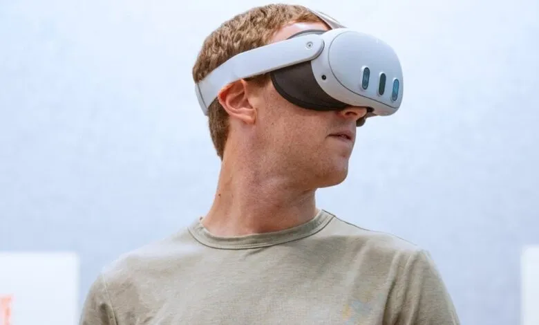 Mark Zuckerberg wearing a white virtual reality headset.