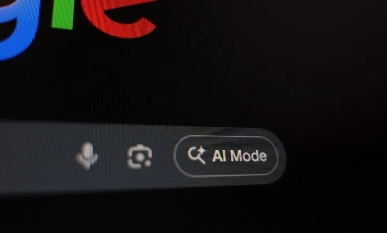 Close-up of a computer screen displaying the Google logo and an 'AI Mode' button.