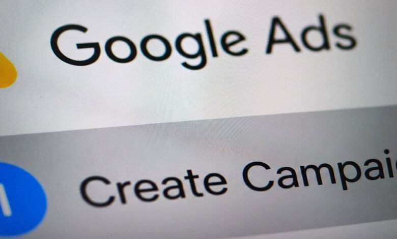 Close-up of a smartphone screen displaying the Google Ads interface.