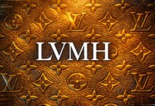 LVMH logo in white text on a textured gold background with Louis Vuitton symbols.