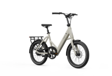 Beige Tinways e-bike with black accents, rear rack, and small wheels.