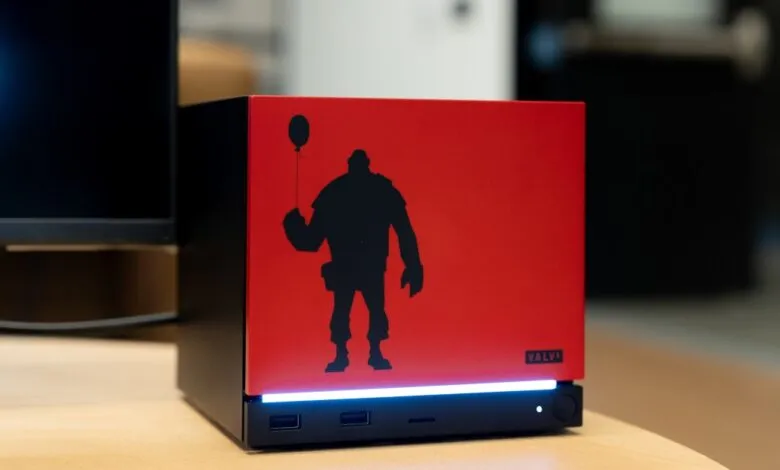 Valve PC with Heavy silhouette holding balloon on red panel.