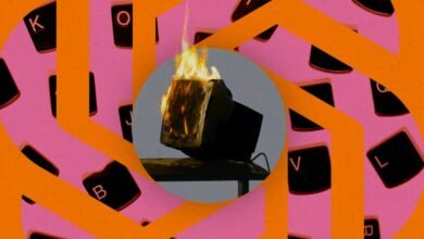 Burning computer monitor against keyboard key background.