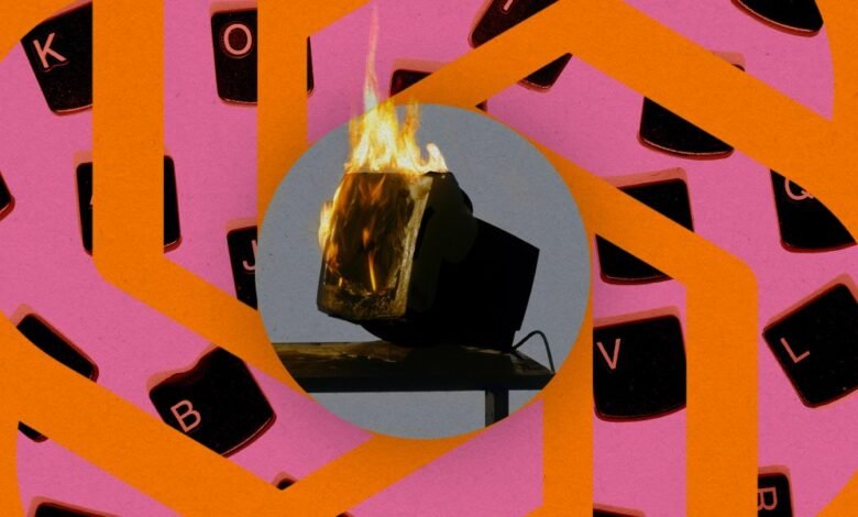 Burning computer monitor against keyboard key background.