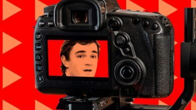 Camera screen shows Nick Shirley's face against a red triangle background.