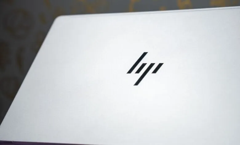Close-up of a silver HP laptop with the HP logo.
