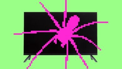 Smart TV screen with a pink pixelated spider web design overlayed.