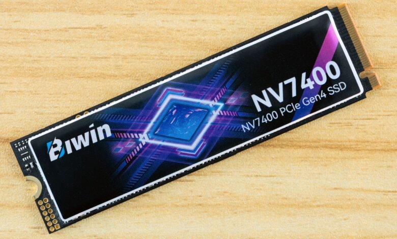 Biwin NV7400 PCIe Gen4 SSD on a light wood surface.
