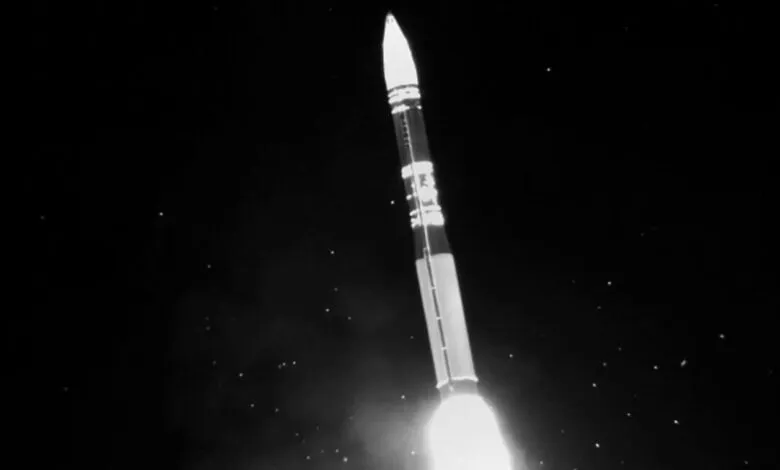 Minuteman III ICBM soars against a dark sky during a test launch.