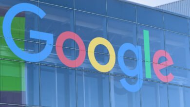 Google logo displayed on the exterior of a modern glass building.