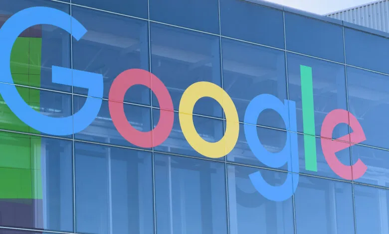 Google logo displayed on the exterior of a modern glass building.