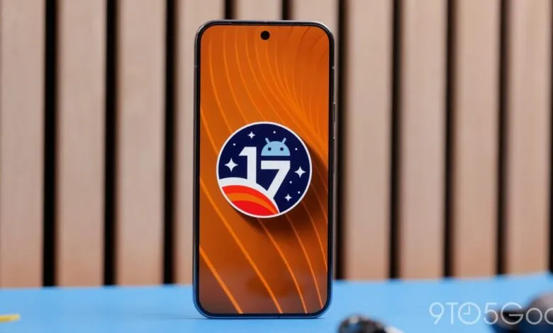 Smartphone displaying Android 17 logo on orange background.