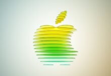 Abstract Apple logo made of layered discs, gradient from yellow to green.