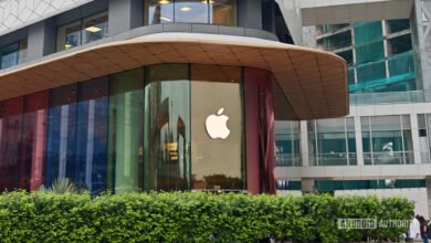 Apple Store exterior with colorful glass panels and Apple logo.