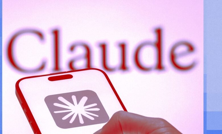 Close-up of a phone displaying the Claude AI app icon.