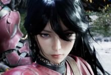 Close-up of a dark-haired woman with a determined expression.