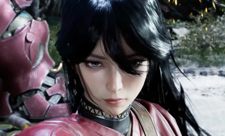 Close-up of a dark-haired woman with a determined expression.