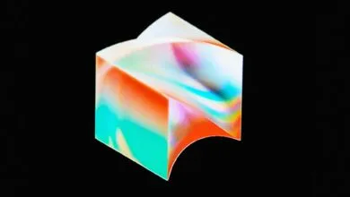 Abstract cube with colorful gradient on black background.