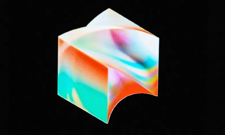 Abstract cube with colorful gradient on black background.