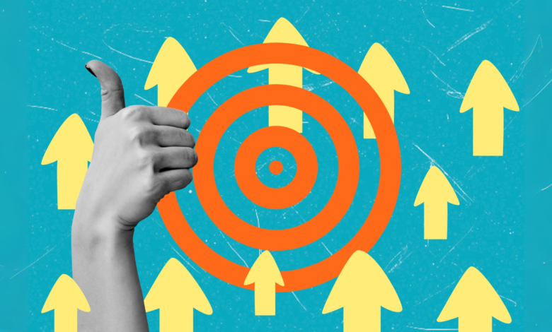 Hand giving thumbs up with target and arrows, success concept.