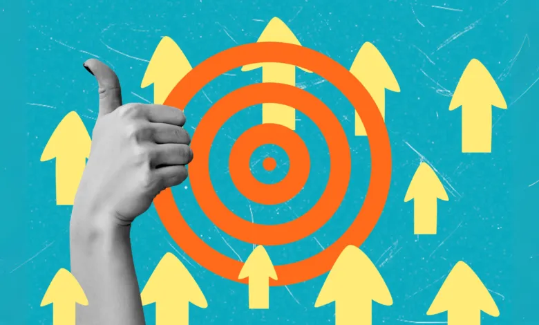 Hand giving thumbs up with target and arrows, success concept.