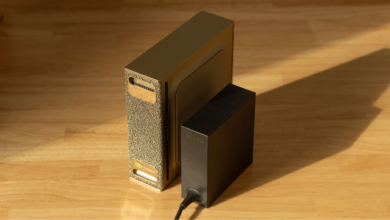 NVIDIA Jetson Orin Nano Developer Kit and power supply on a wooden surface.